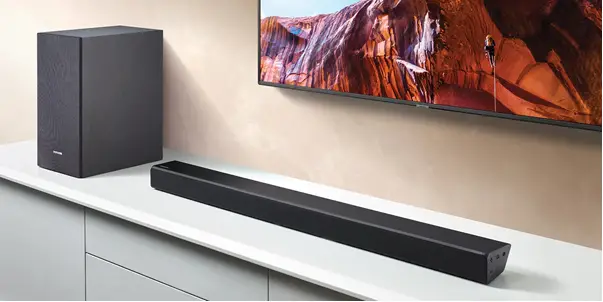Picture of soundbar on a TV cabinet.