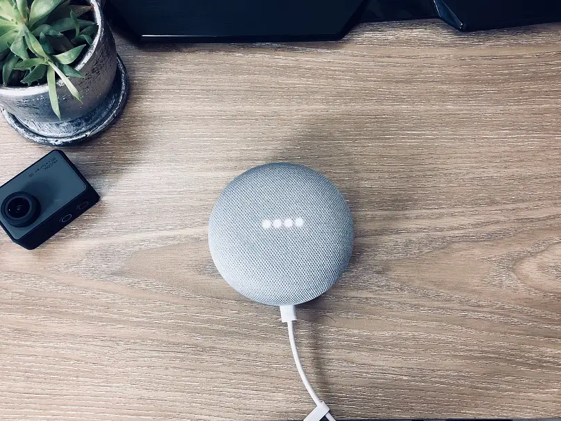 Bird's eye view of Google Home speaker on kitchen table