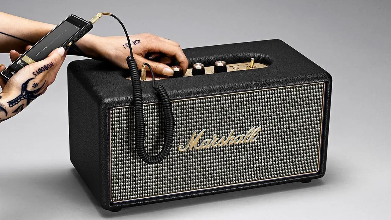 Marshall Bluetooth speaker being turned louder.